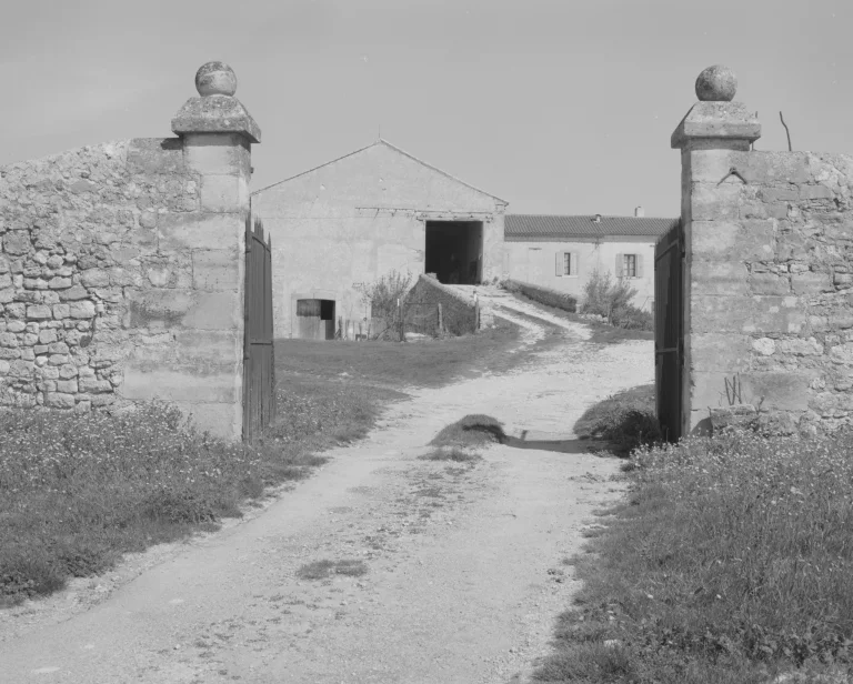 Historic stone gateway of the terres de Sarson, black and white archive photograph